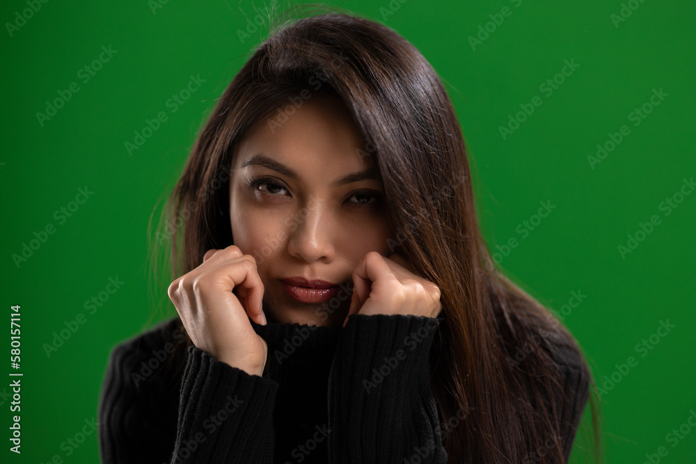Young Asian woman with a beautiful face - portrait shot against color background. High quality photo Young Asian woman with a beautiful face - portrait shot against color background. High quality photo