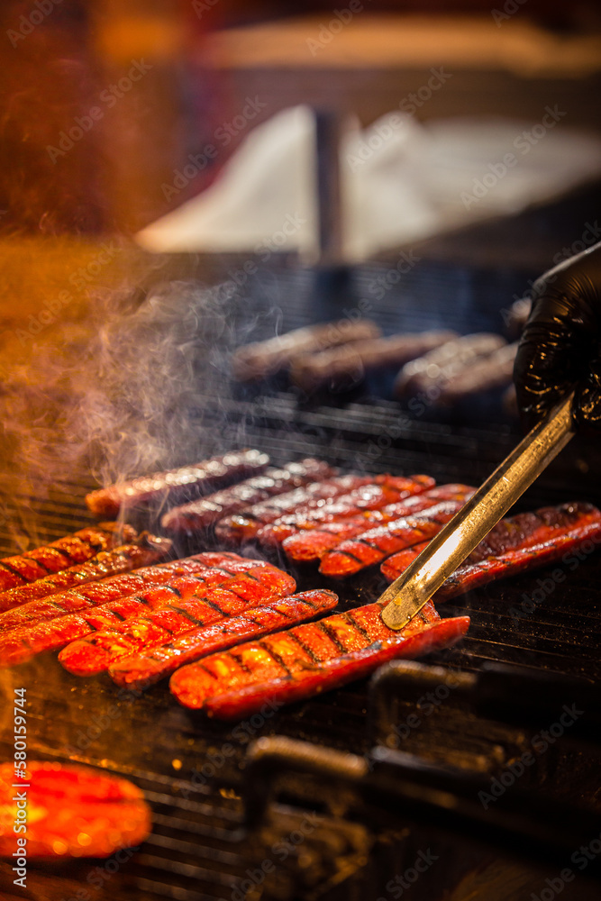 Fototapeta premium barbecue grilled meat and sausages fire and smoke