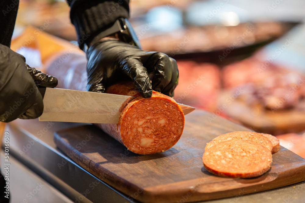 Meat department, showcase with variety of meat in different cuts. Inside an supermarket. Different types of fresh meat arranged in an orderly manner. Meat department, showcase with variety of meat in different cuts. Inside an supermarket. Different types of fresh meat arranged in an orderly manner.