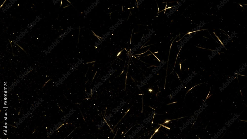 Super Slow Motion Shot of Golden Glittering Confetti Background at 1000fps. Super Slow Motion Shot of Golden Glittering Confetti Background at 1000fps.