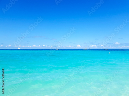 Fototapeta Naklejka Na Ścianę i Meble -   background of the turquoise ocean and blue sky.relaxing holiday.Zanzibar, Tanzania