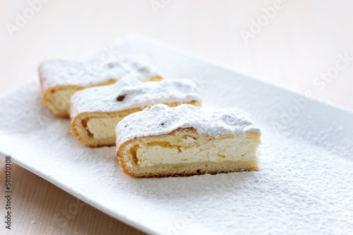 cheesecake curd strudel sliced sprinkled with powdered sugar dough is separated from curd creating drawing ad benefits of cooking show recipes restaurant serving delicious on unrealistically beautiful