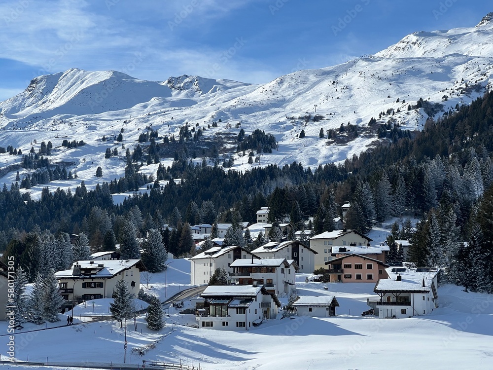 Swiss alpine holiday homes, mountain villas and holiday apartments in the winter ambience of the tourist resorts of Valbella and Lenzerheide in the Swiss Alps - Canton of Grisons, Switzerland (Schweiz