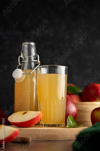 Apple juice drink with fresh red apples  wooden background. dark bakground