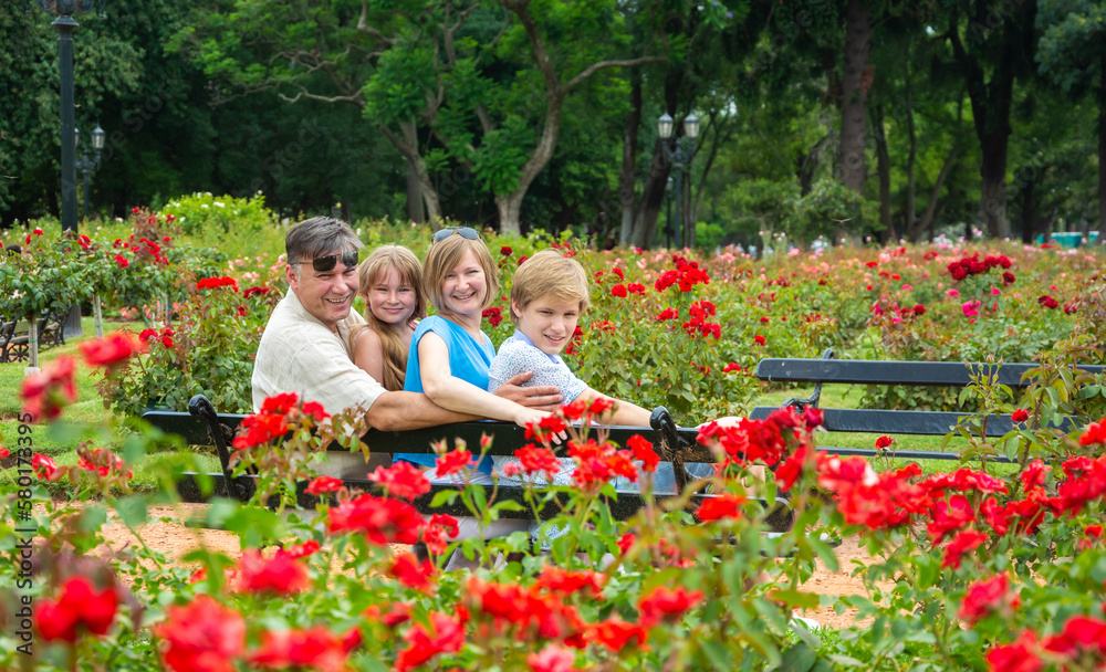 happy family relaxing in the park happy family relaxing in the park