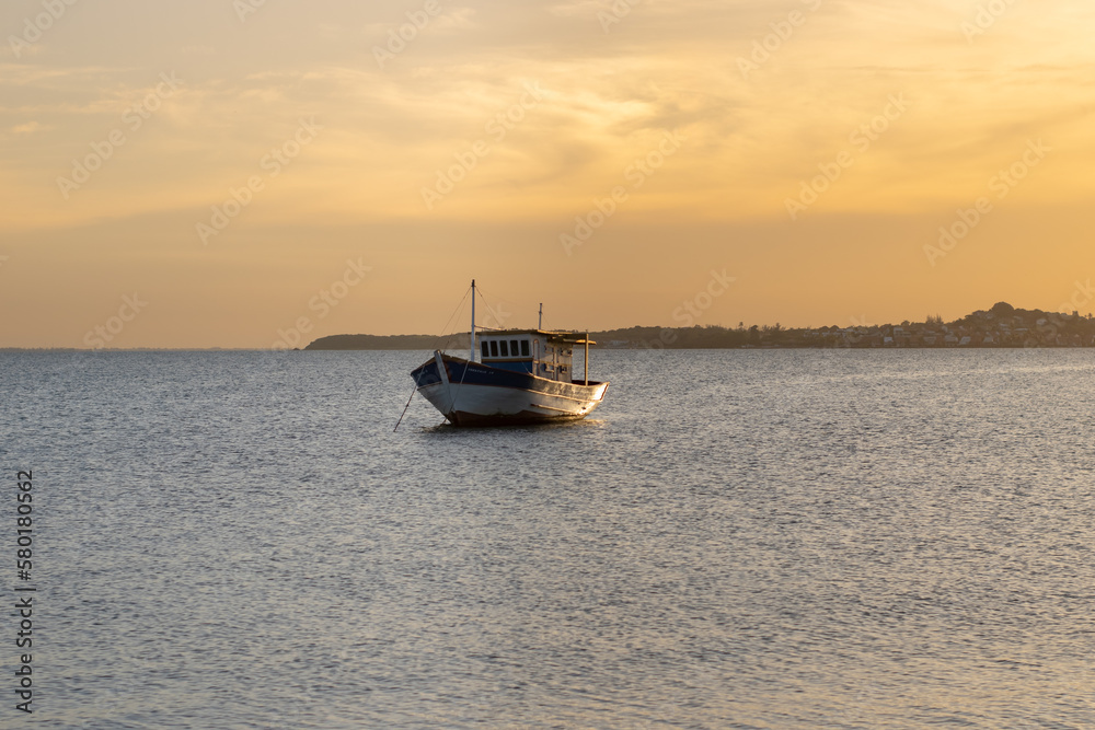 Fishing boat on the sea at sunset. Beautiful natural background.