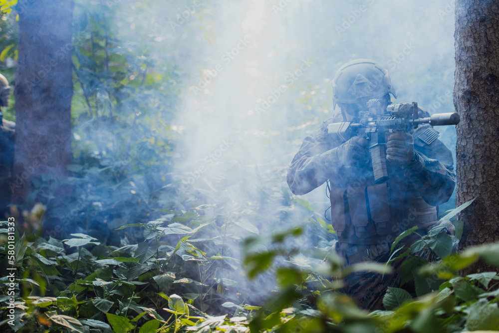 A modern warfare soldier on war duty in dense and dangerous forest areas. Dangerous military rescue operations