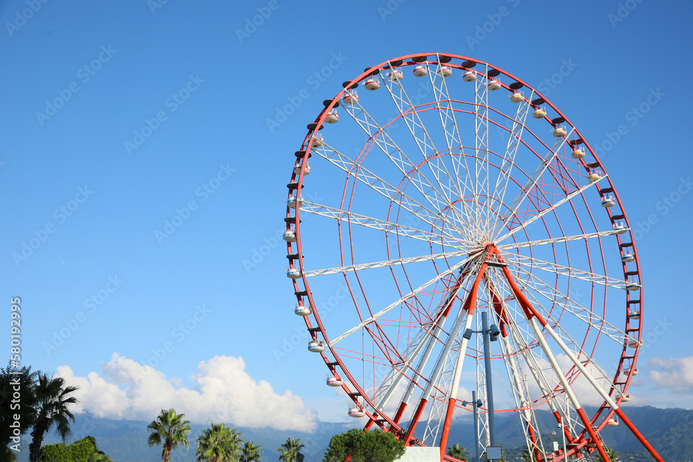 Fototapeta premium Beautiful large Ferris wheel outdoors, space for text
