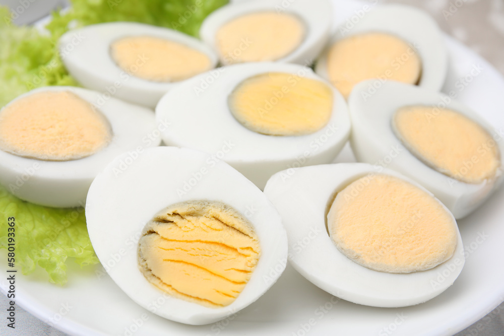 Fresh hard boiled eggs and lettuce on plate, closeup Fresh hard boiled eggs and lettuce on plate, closeup