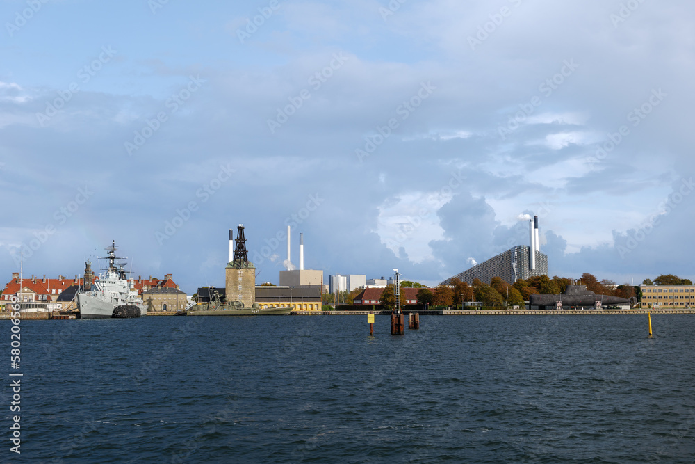 Outdoor exterior view  cityscape along waterfront and background of The historic warships on Holmen,The floating museum of Copenhagen at Nyholm and CopenHill.