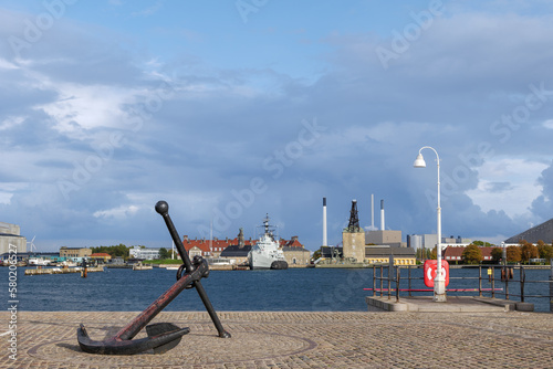 Photography Selective focus at anchor sculpture and backgroud of cityscape along waterfront and background of The historic warships on Holmen,The floating museum of Copenhagen at Nyholm and CopenHill