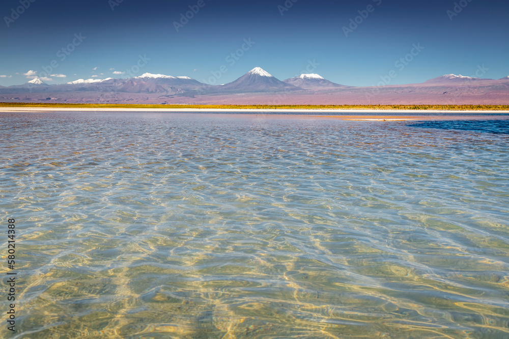 Licancabur with reflection lake and volcanic landscape at Sunset, Atacama, Chile