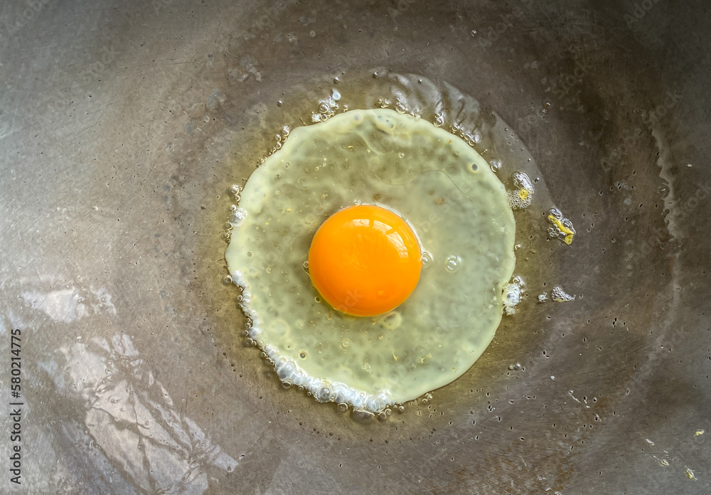 Fried eggs in a hot pan looks appetizing It's a simple breakfast. with high nutritional components such as protein or fat Egg yolks contain cholesterol and egg whites contain muscle-building protein. Fried eggs in a hot pan looks appetizing It's a simple breakfast. with high nutritional components such as protein or fat Egg yolks contain cholesterol and egg whites contain muscle-building protein.