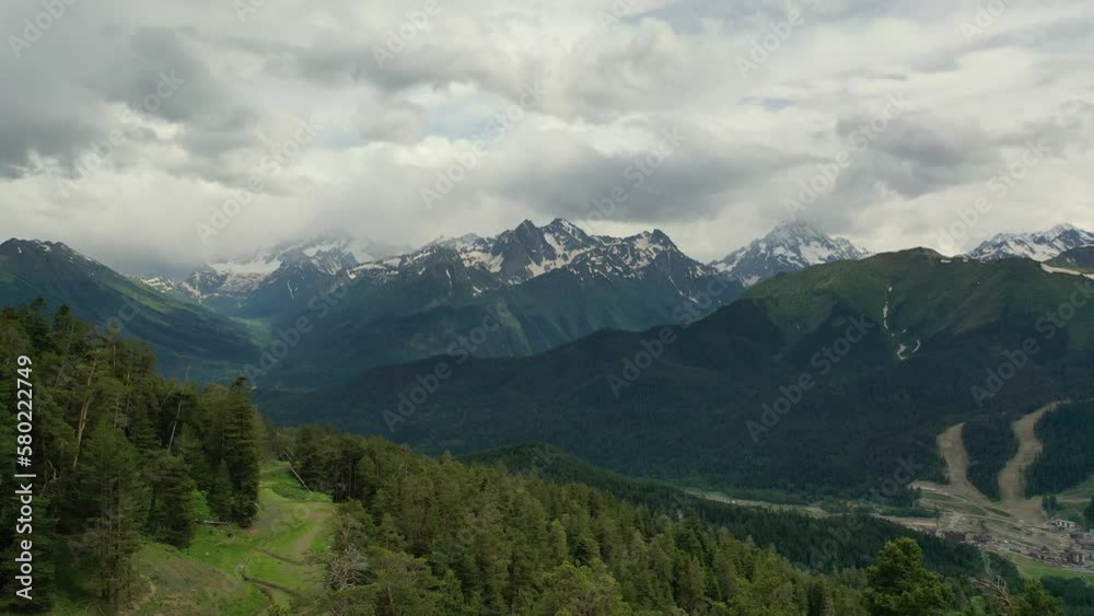 Slow takeoff along the trees, view of the mountain tops. Wildlife in the mountains. Slow takeoff along the trees, view of the mountain tops. Wildlife in the mountains.
