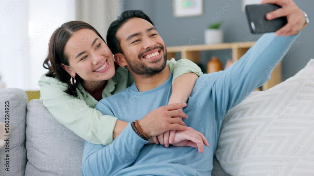 Asian couple taking selfie on phone at home, love and care for social ...