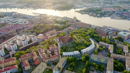 Gothenburg, Sweden - June 25, 2019: StenaLine ferry passes along the river. Panorama of the city and the river Goeta Elv, From Drone photo