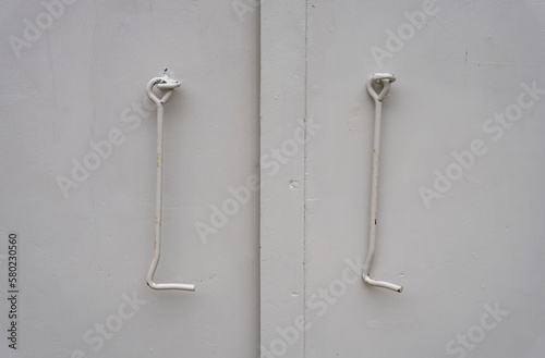 Door hooks for fixing iron doors in the open position