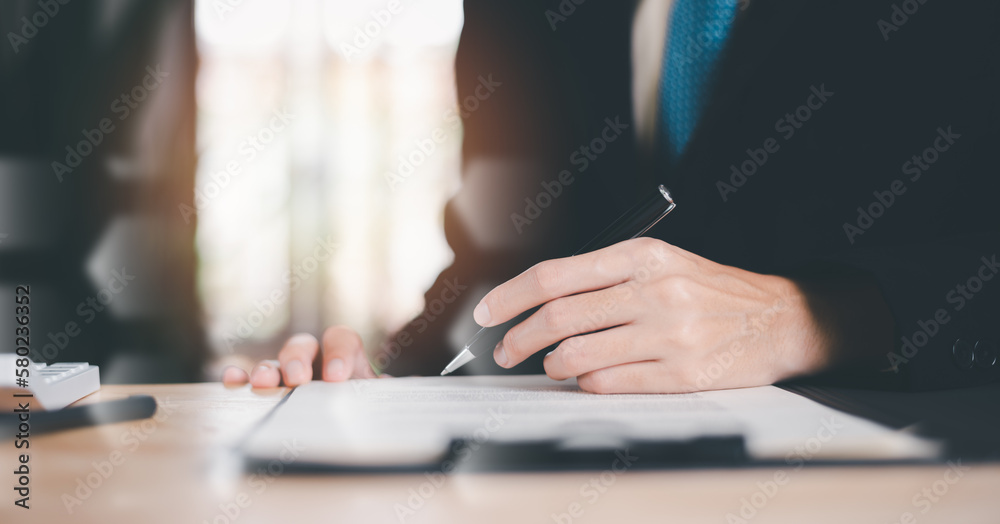 Businessman reviewing and managing business documents and agreements online ,signing a business contract approval of contract documents confirmation or warranty certificate ,employment idea Businessman reviewing and managing business documents and agreements online ,signing a business contract approval of contract documents confirmation or warranty certificate ,employment idea