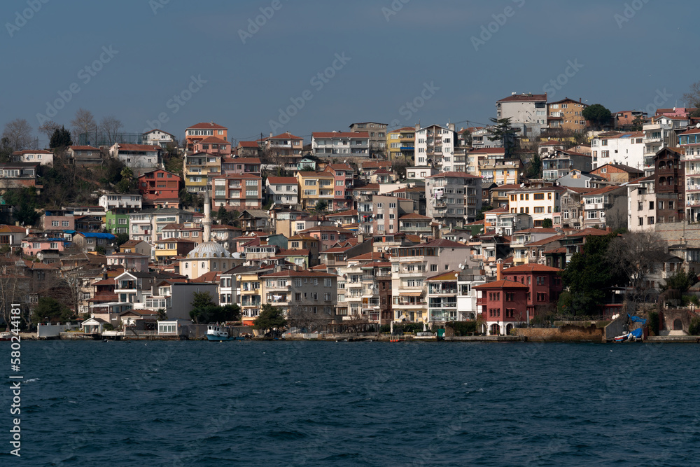 View of the Yenimahalle district of Istanbul, part of the Beykoz district from the Bosporus water area on a sunny day, Istanbul, Turkey