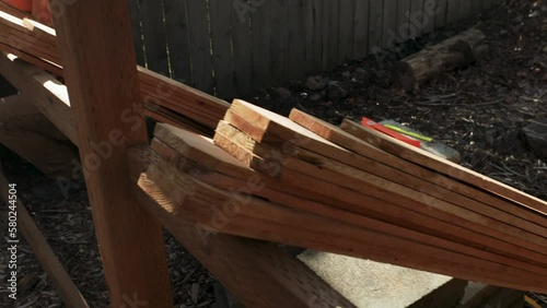 Pickets Lined Up as Man Starts Working on Building Fence