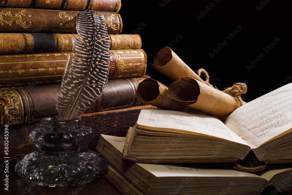 Medieval table with books, inkwell and scrolls. Concept on the theme of history.