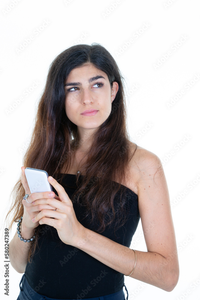 beauty woman with long hair brunette holding a phone smartphone in hand look side beauty woman with long hair brunette holding a phone smartphone in hand look side