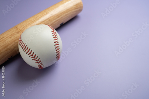 Canvas Print Close up baseball and baseball bat on purple table with copy space background, s
