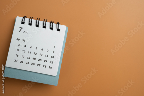 close up of calendar on the yellow table background, planning for business meeting or travel planning concept