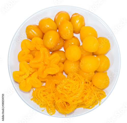 egg yoke fudge balls cooked in syrup isolated