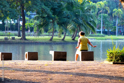 the old woman, senior sitting on a bench in the park