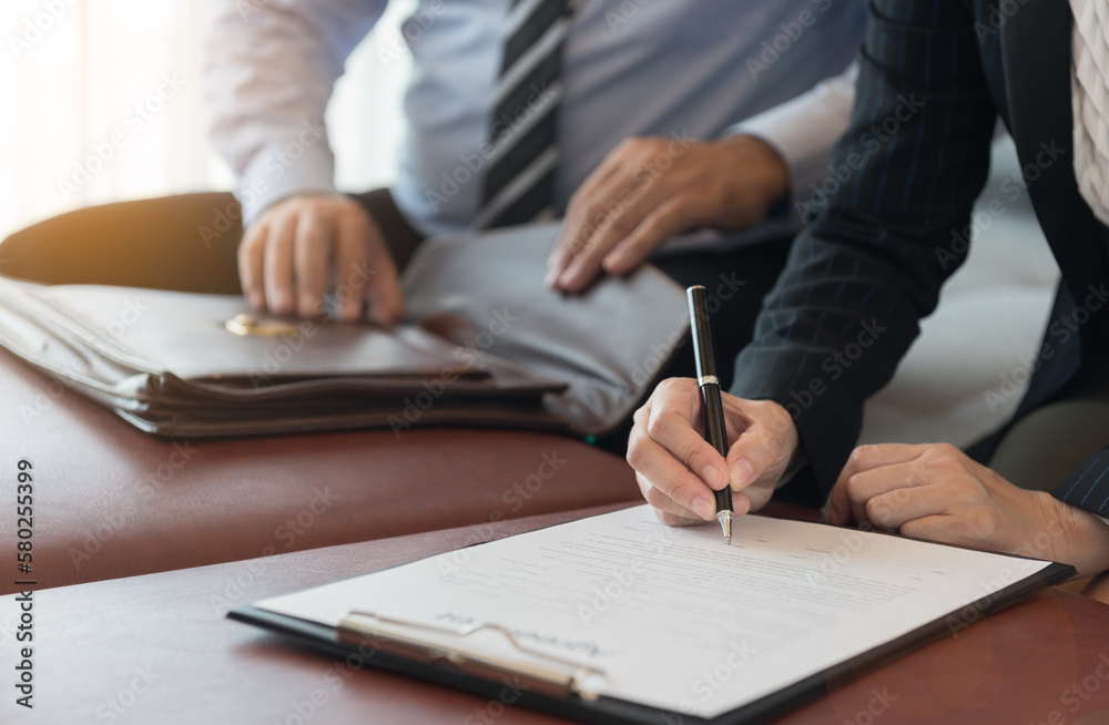 business people signing contract or business agreement documents for business deal. business people signing contract or business agreement documents for business deal.
