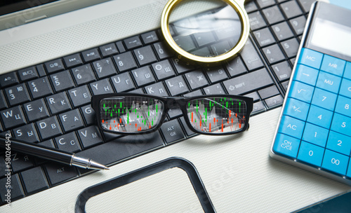 Stock market statistics on eyeglasses. Forex trading analysis