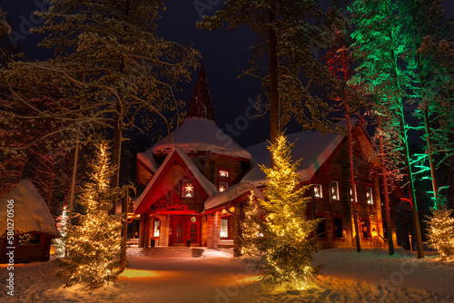 Rovaniemi, Finland - 20 February 2023 Illuminated house in the Santa Clause Village photo