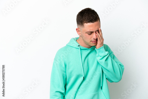 Young brazilian man isolated on white background with headache