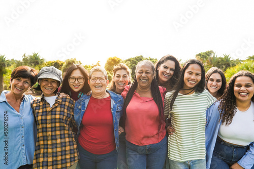 Multi generational women smiling in front of camera - Female multiracial group having fun togheter outdoor