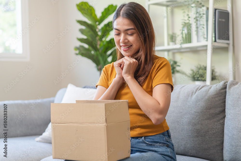 Excited Young females opening box at home Excited Young females opening box at home