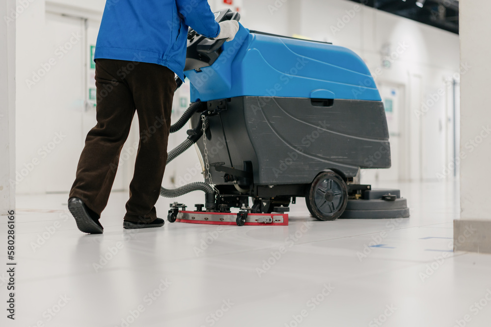 cleaning floor with machine