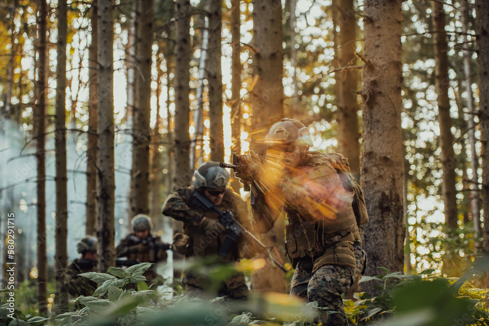 A group of modern warfare soldiers is fighting a war in dangerous remote forest areas. A group of soldiers is fighting on the enemy line with modern weapons. The concept of warfare and military A group of modern warfare soldiers is fighting a war in dangerous remote forest areas. A group of soldiers is fighting on the enemy line with modern weapons. The concept of warfare and military