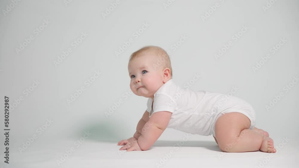 A 6-month-old baby begins to learn to crawl. A 6-month-old baby begins to learn to crawl.