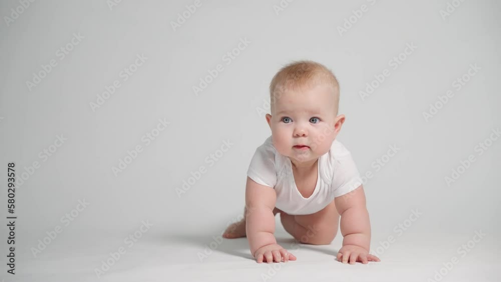 A 6-month-old baby begins to learn to crawl. A 6-month-old baby begins to learn to crawl.