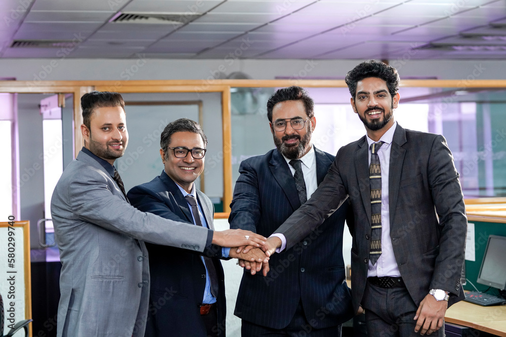 Indian businesspeople group hand shake after successful meeting Indian businesspeople group hand shake after successful meeting