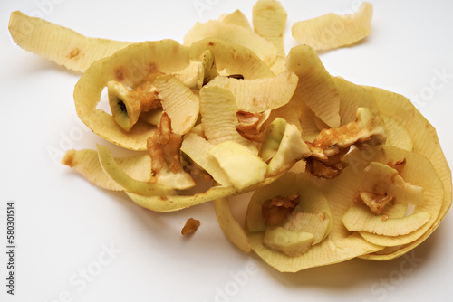 Peels and cores of apples on a white background. Close-up