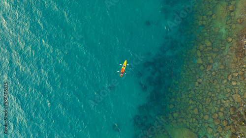 	
Aerial view of a kayak in the blue sea .Woman kayaking She does water sports activities.Natural and lifestyle tourism