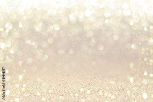 Silver sparkling background with shiny blurred round bokeh.