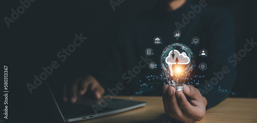 Business  hand using lamp with virtual popup icon of cloud computin Storage and data transfer Cloud network , Cloud technology. Networking and internet service concept. photo