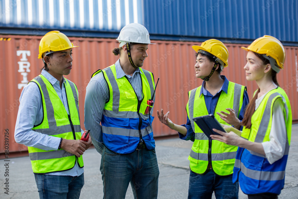 Teamwork engineer technician and foreman and partner wearing safety helmet in cargo container shipping area, worker successful, container background. Teamwork engineer technician and foreman and partner wearing safety helmet in cargo container shipping area, worker successful, container background.