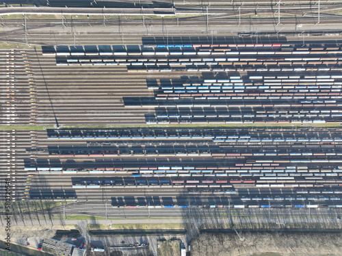Billede på lærred Aerial drone footage top down view of a picturesque locomotive depot with a vast array of tracks and trains