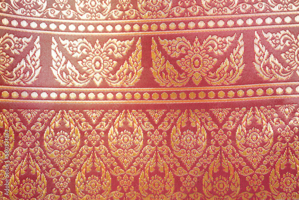 The Thai style pattern fabric close up background. The Thai style pattern fabric close up background.