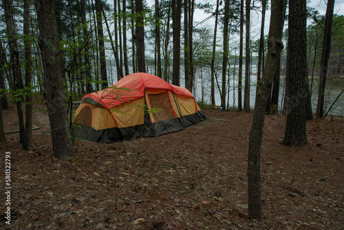 Tent on an overcast day near a lake