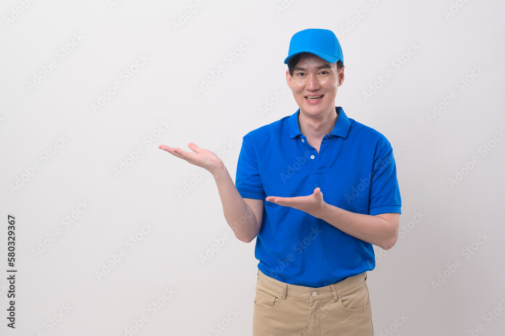 An Asian young Technician service man wearing blue uniform on white background studio An Asian young Technician service man wearing blue uniform on white background studio